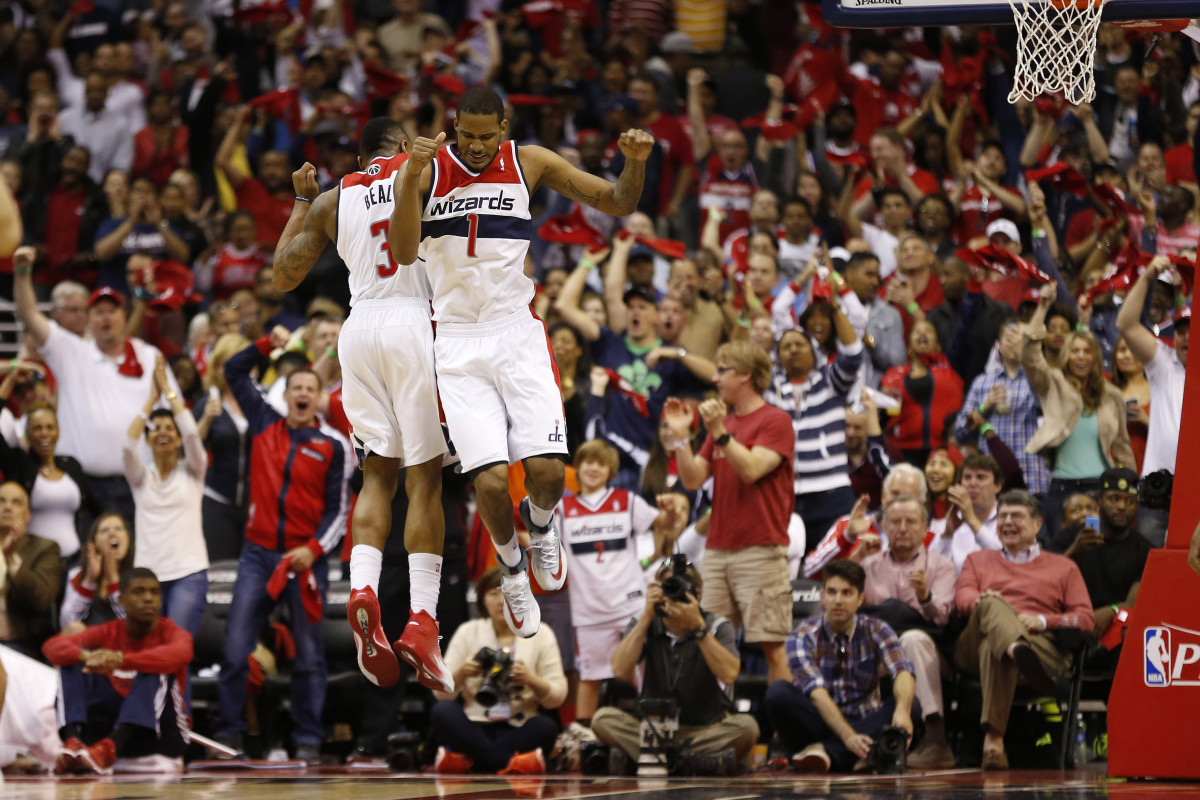 Apr 27, 2014; Washington, DC, USA; Washington Wizards forward Trevor Ariza (1) and Wizards guard Bradley Beal (3) celebrate in the closing seconds of the fourth quarter against the Chicago Bulls in game four of the first round of the 2014 NBA Playoffs at Verizon Center. The Wizards won 98-89. Mandatory Credit: Geoff Burke-USA TODAY Sports